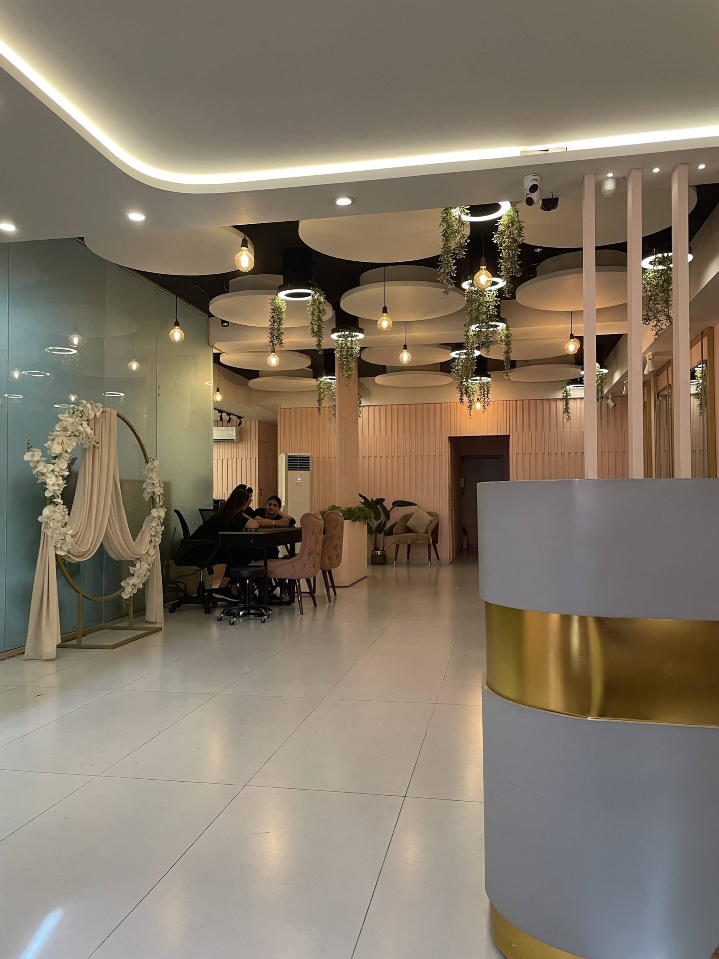 HER salon reception with floral hoop